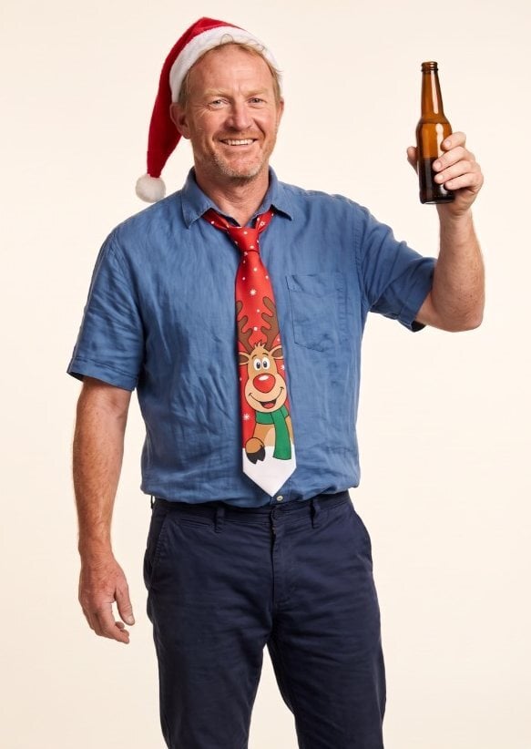 Dave in a Santa hat holding a beer