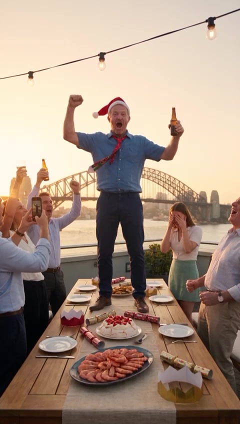 Dave standing on the table in a Santa hat