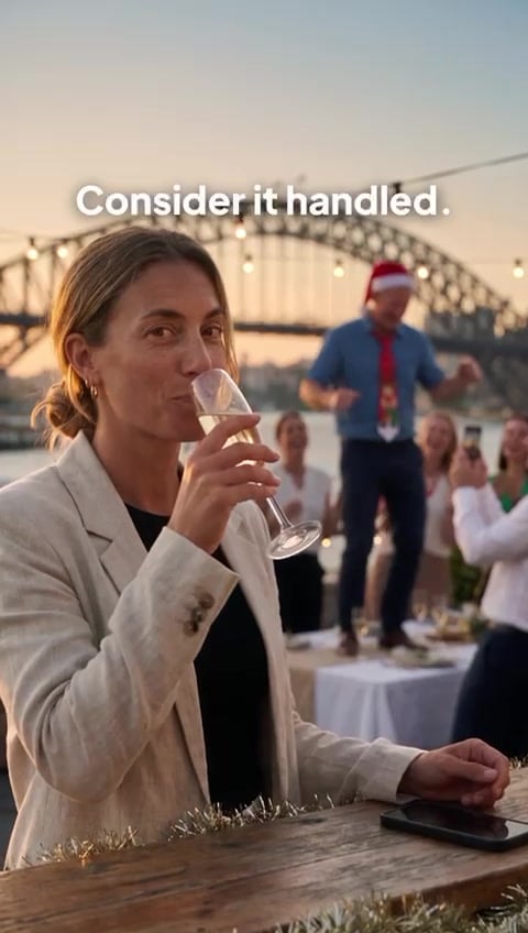 Mel raising her glass