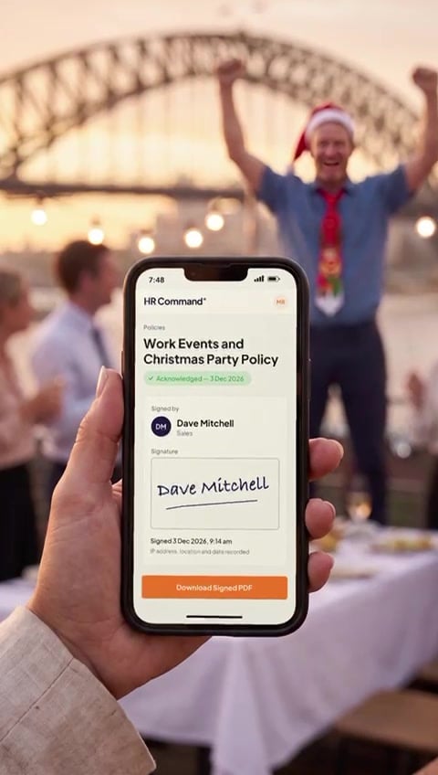 Phone showing Dave signed the Work Events and Christmas Party Policy in HR Command